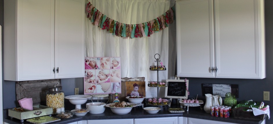 The spread.  Instead of a cake I had cupcakes in the tower.  Green mason jars for the mommies drinks.  Chevron pink straws.